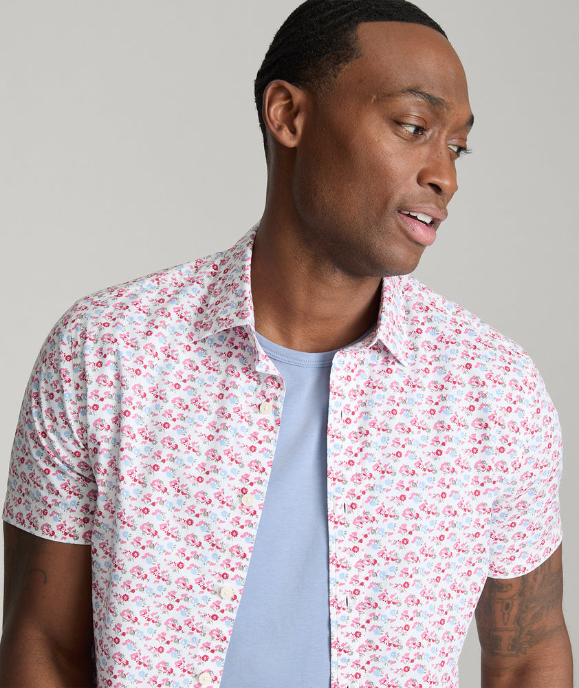 Model is wearing UNTUCKit Sanchez short sleeve shirt in pink.