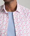 Model is wearing UNTUCKit Sanchez short sleeve shirt in pink.