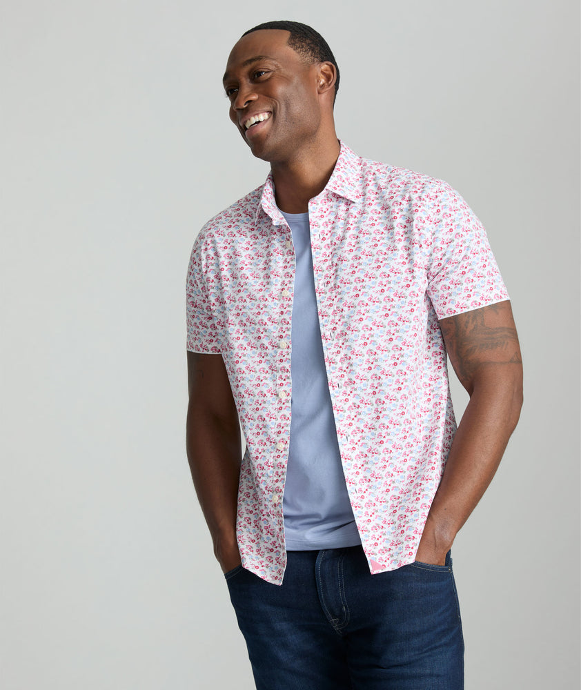 Model is wearing UNTUCKit Sanchez short sleeve shirt in pink.