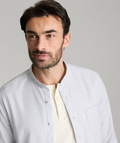 Model is wearing UNTUCKit Sanders shirt is alloy.