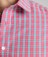 Model is wearing UNTUCKit Wrinkle-Free Santos Shirt in pink. 