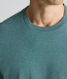Model is wearing UNTUCKit Ultrasoft Tee in green. 