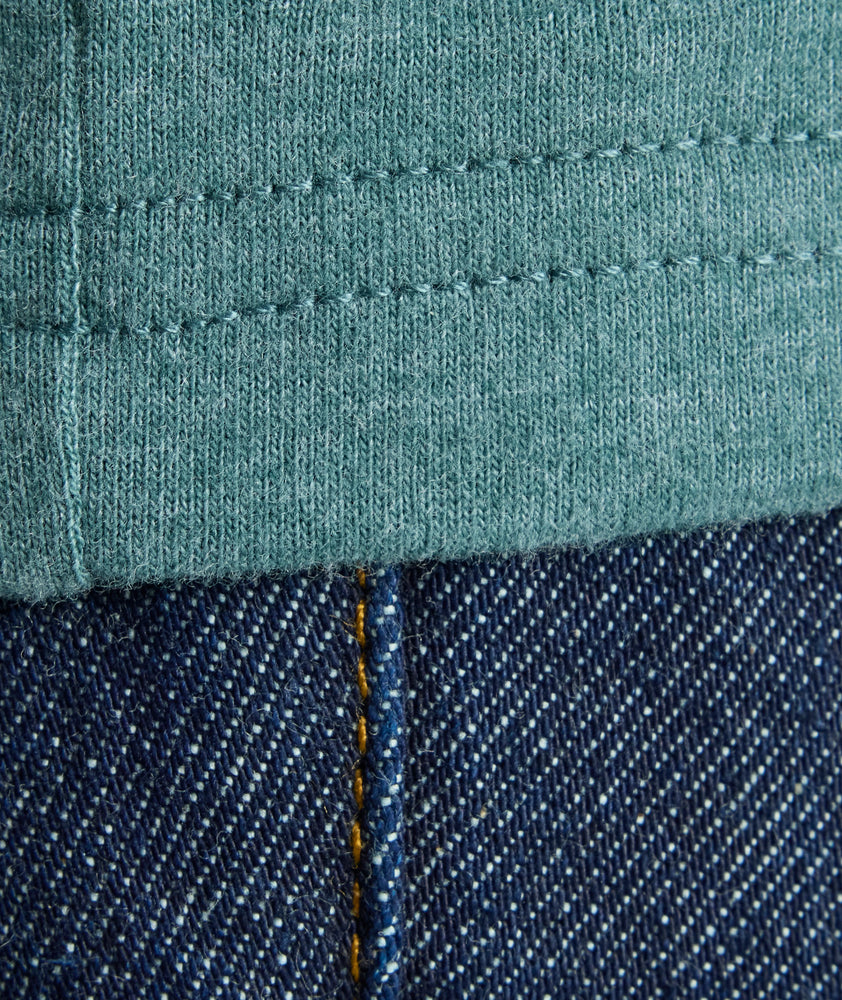 Model is wearing UNTUCKit Ultrasoft Tee in green. 