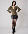 Model is wearing UNTUCKit Scarlett gold top.