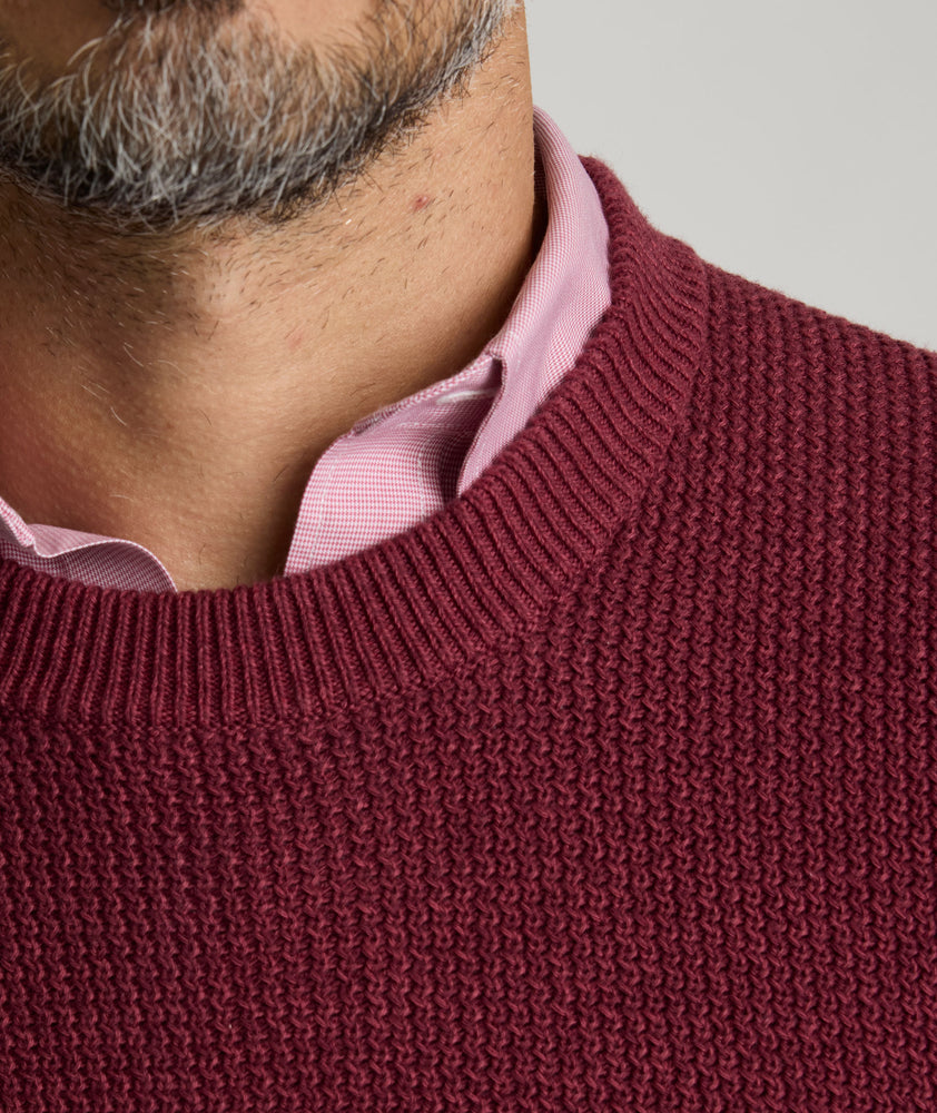 Model is wearing UNTUCKit seaver soild red sweater. 