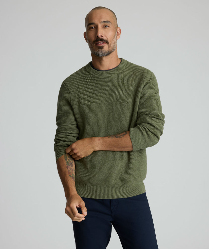 Model is wearing UNTUCKit Seaver Crewneck in Beetle Green.