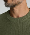 Model is wearing UNTUCKit Seaver Crewneck in Beetle Green.