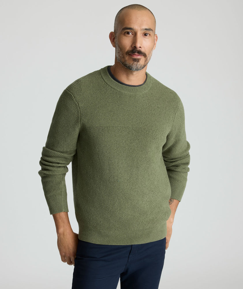Model is wearing UNTUCKit Seaver Crewneck in Beetle Green.