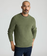 Model is wearing UNTUCKit Seaver Crewneck in Beetle Green.