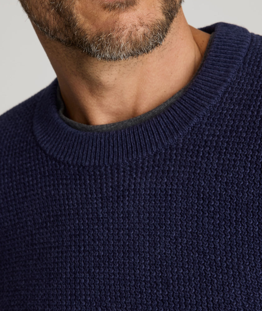 Model is wearing UNTUCKit Seaver Crewneck in Evening Blue.