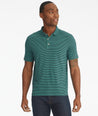 Model is wearing UNTUCKit Segura stripe polo. 