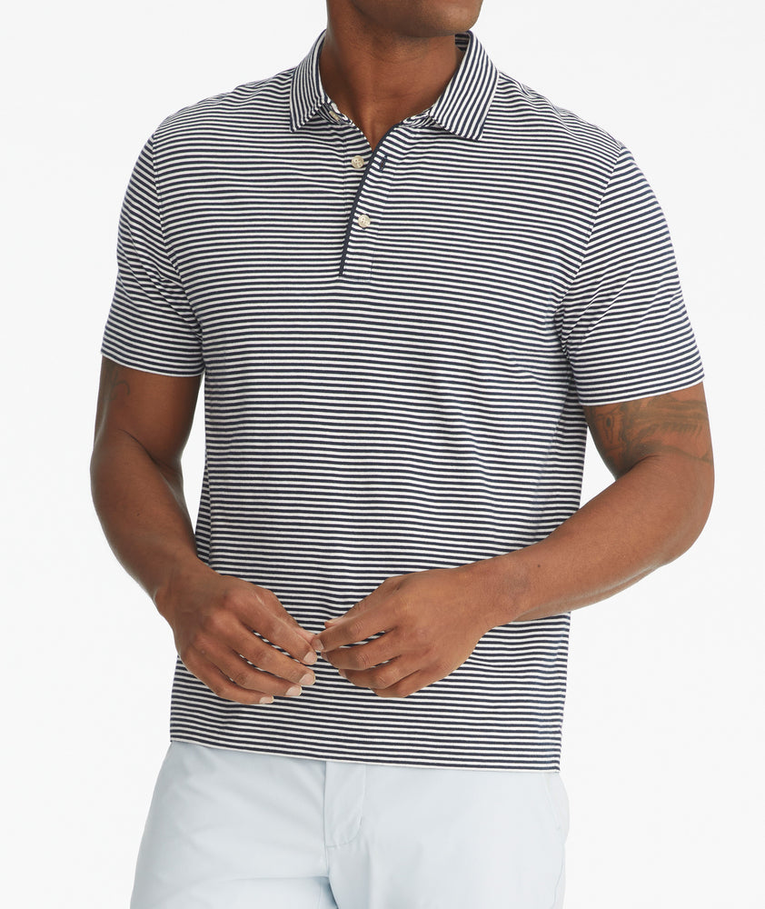 Model is wearing UNTUCKit Segura stripe polo.