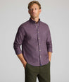 Model is wearing UNTUCKit Wrinkle-Free Serfield Shirt in Multicolor Check.