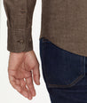 Model is wearing UNTUCKit Flannel Sherwood Shirt in chocolate.