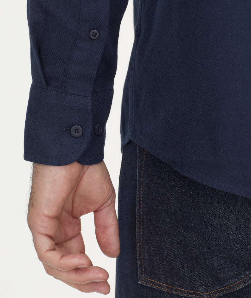 Model is wearing UNTUCKit Flannel Sherwood Shirt in dark navy.