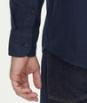 Model is wearing UNTUCKit Flannel Sherwood Shirt in dark navy.