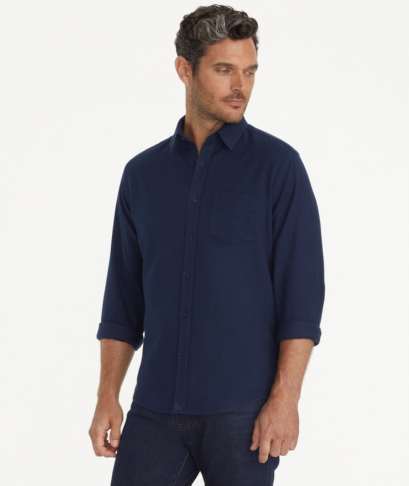 Model is wearing UNTUCKit Flannel Sherwood Shirt in dark navy.