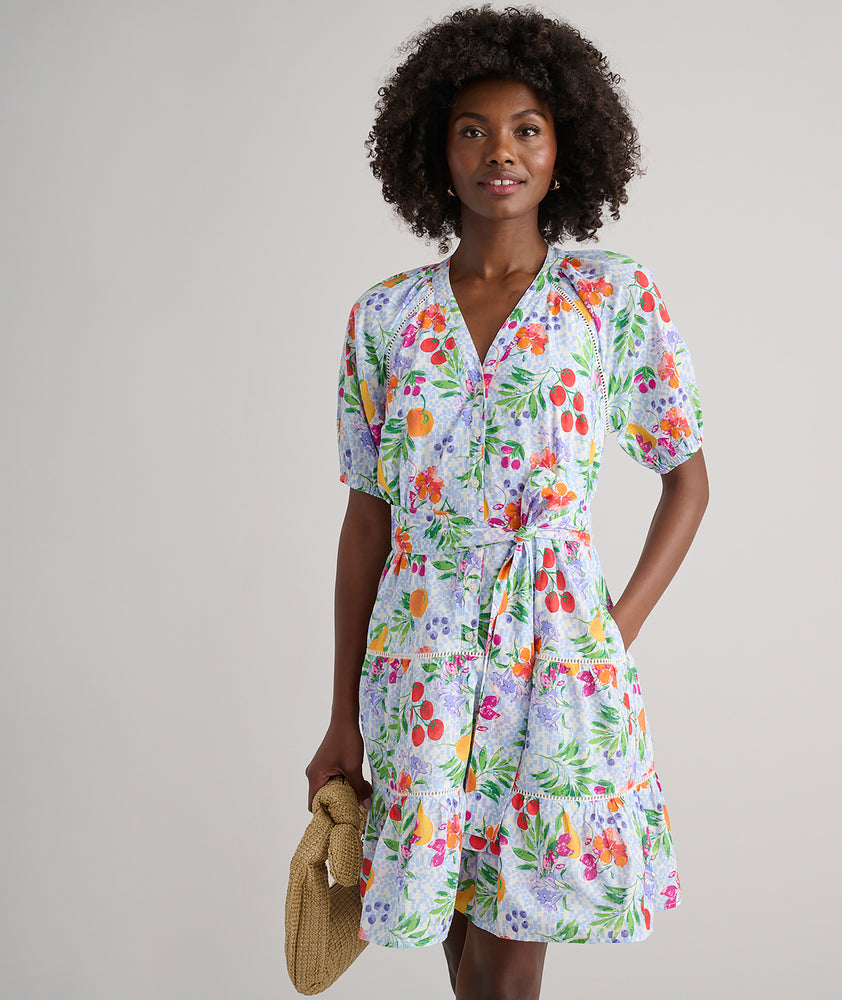 Model is wearing UNTUCKit Sierra dress in fruit print.