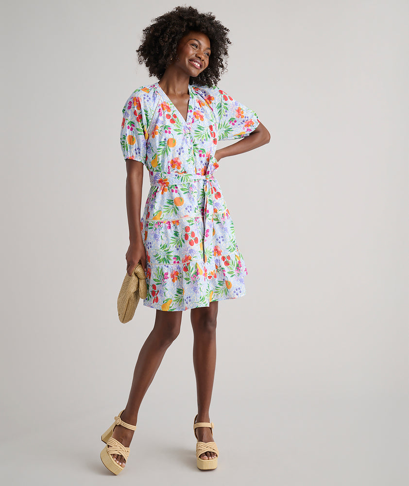 Model is wearing UNTUCKit Sierra dress in fruit print.