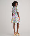 Model is wearing UNTUCKit Sierra dress in fruit print.