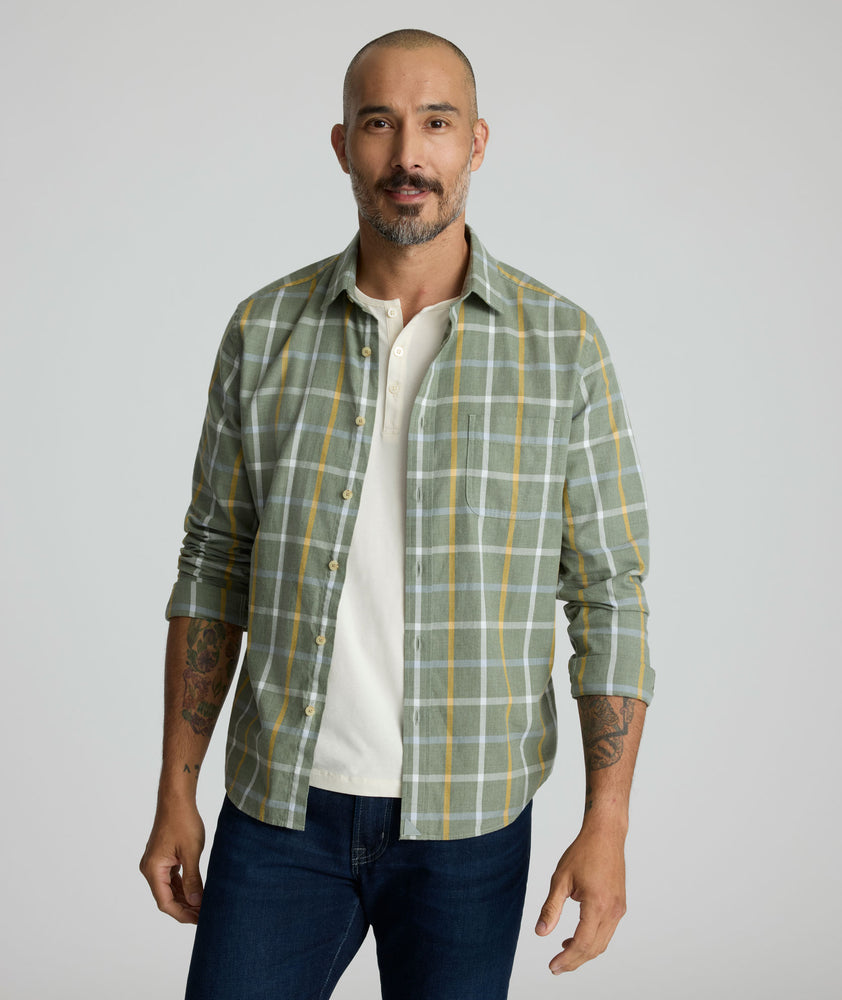 Model is wearing UNTUCKit Silva flannel in green.