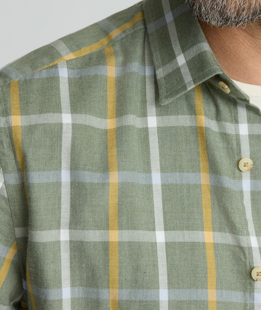Model is wearing UNTUCKit Silva flannel in green.