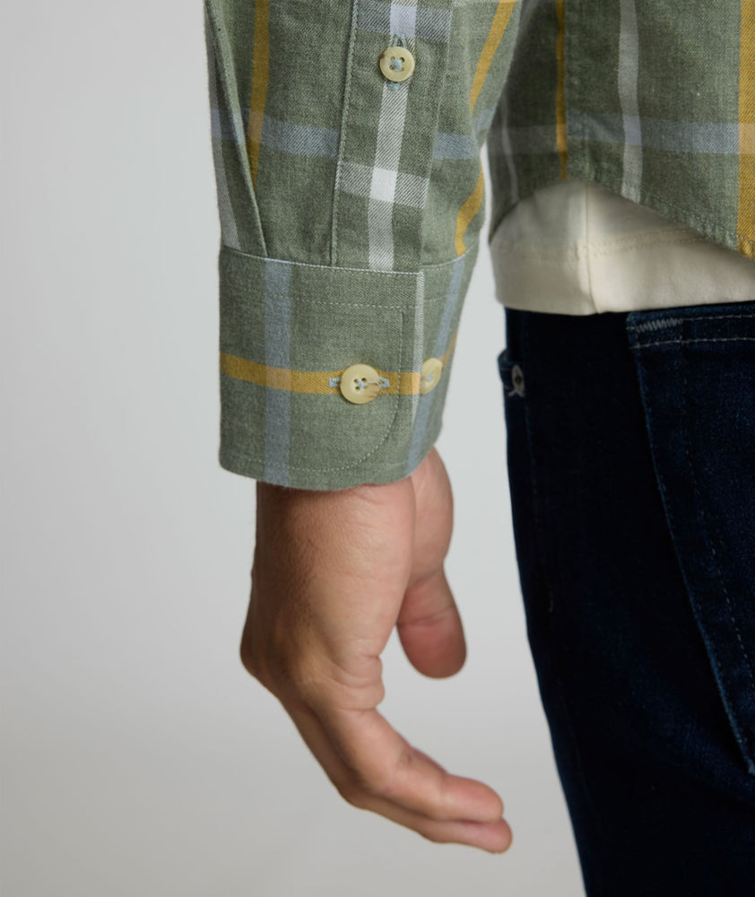 Model is wearing UNTUCKit Silva flannel in green.