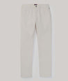 Model is wearing UNTUCKit Traveler Tech Pants in silver birch .