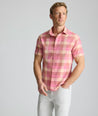 Model is wearing UNTUCKit Vintage Wash Short-Sleeve Silverstone Shirt in pink. 