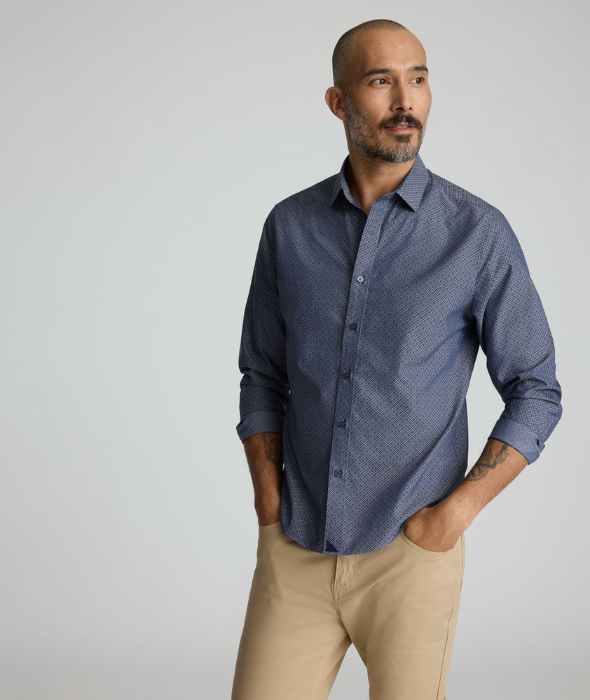 Model is wearing UNTUCKit Smithson wrinkle-free shirt in gray. 