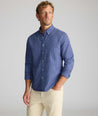 Model is wearing UNTUCKit Wrinkle-Free Solay Shirt in Navy Check.