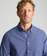 Model is wearing UNTUCKit Wrinkle-Free Solay Shirt in Navy Check.