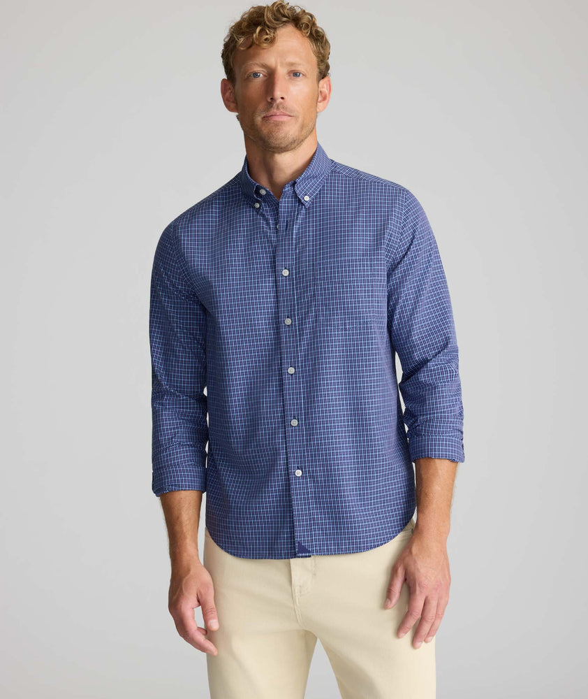 Model is wearing UNTUCKit Wrinkle-Free Solay Shirt in Navy Check.
