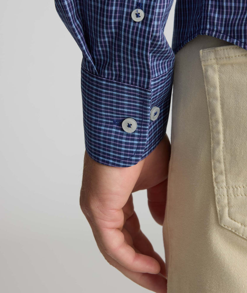 Model is wearing UNTUCKit Wrinkle-Free Solay Shirt in Navy Check.