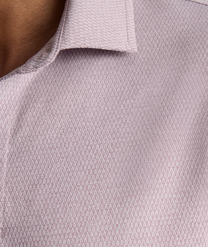 Model is wearing UNTUCKit Textured Performance Polo in fig. 