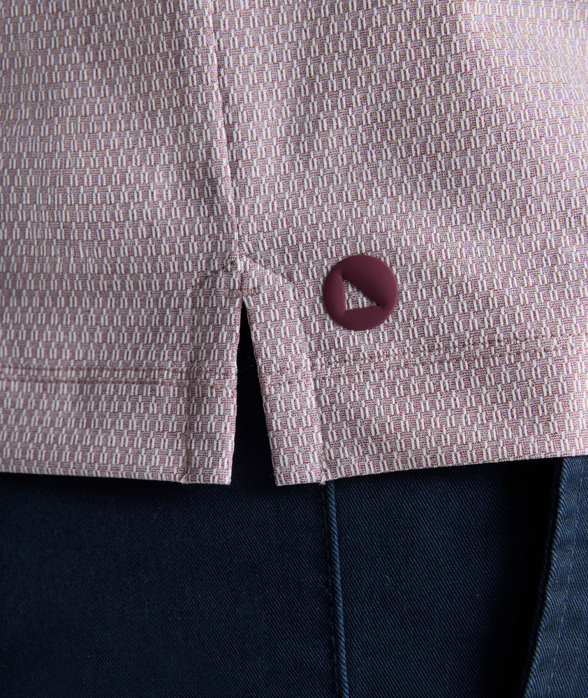 Model is wearing UNTUCKit Textured Performance Polo in fig. 