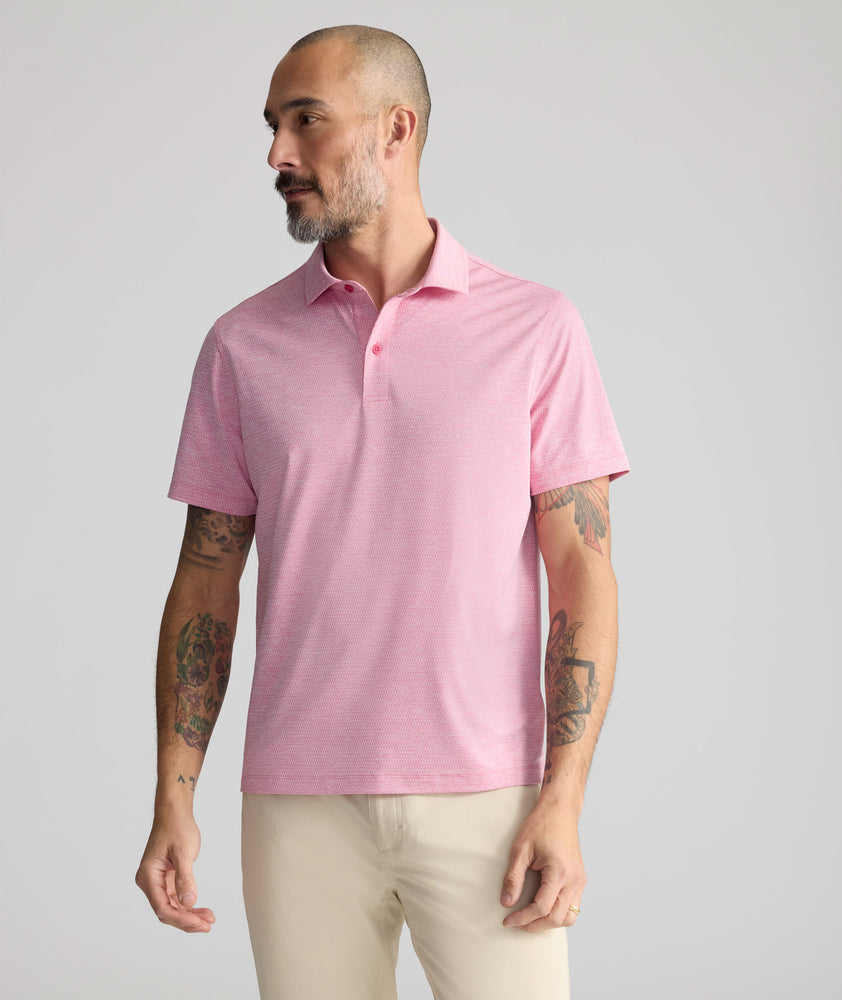 Model is wearing UNTUCKit Textured Performance Polo	in Red.