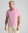 Model is wearing UNTUCKit Textured Performance Polo	in Red.