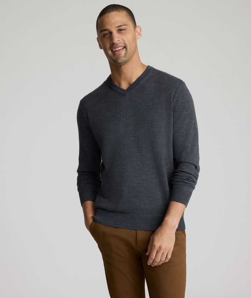 Model wearing a Dark Grey Merino Wool V-Neck Sweater