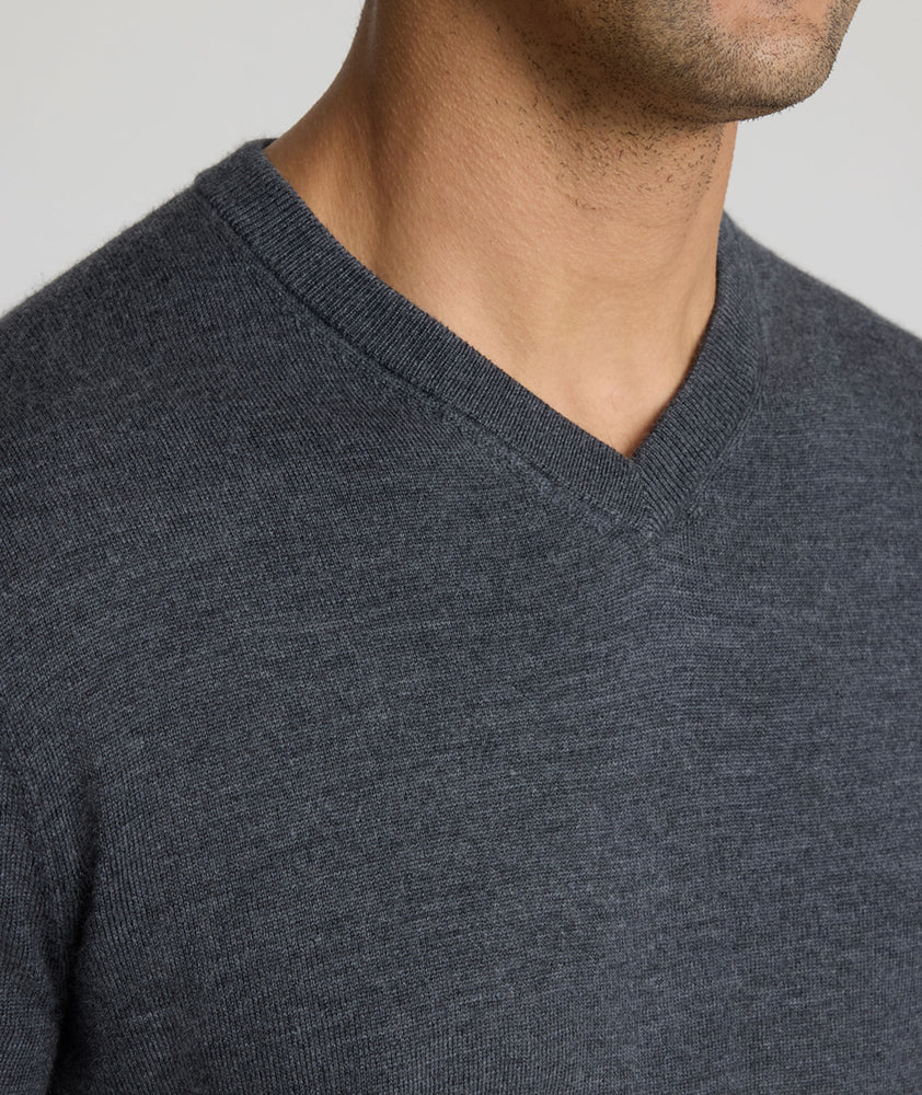 Model wearing a Dark Grey Merino Wool V-Neck Sweater