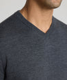 Model wearing a Dark Grey Merino Wool V-Neck Sweater