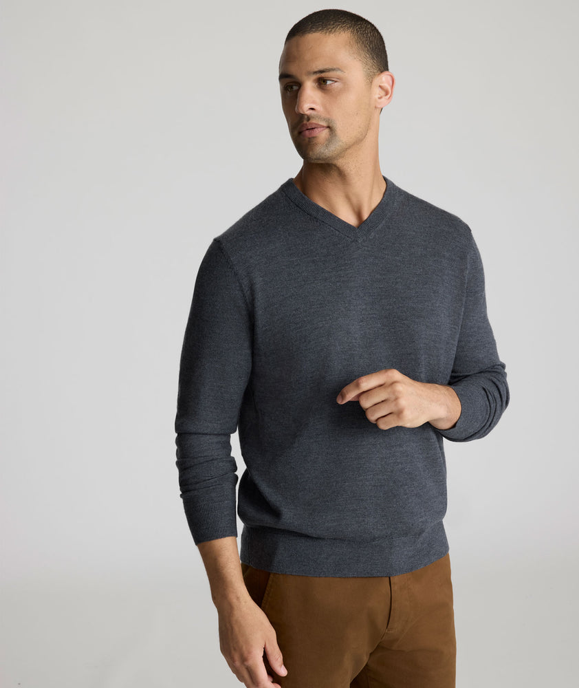 Model wearing a Dark Grey Merino Wool V-Neck Sweater
