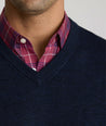 Model is wearing UNTUCKit sweater in navy.