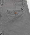 Model is wearing UNTUCKit Classic Chino Pants in Charcoal.