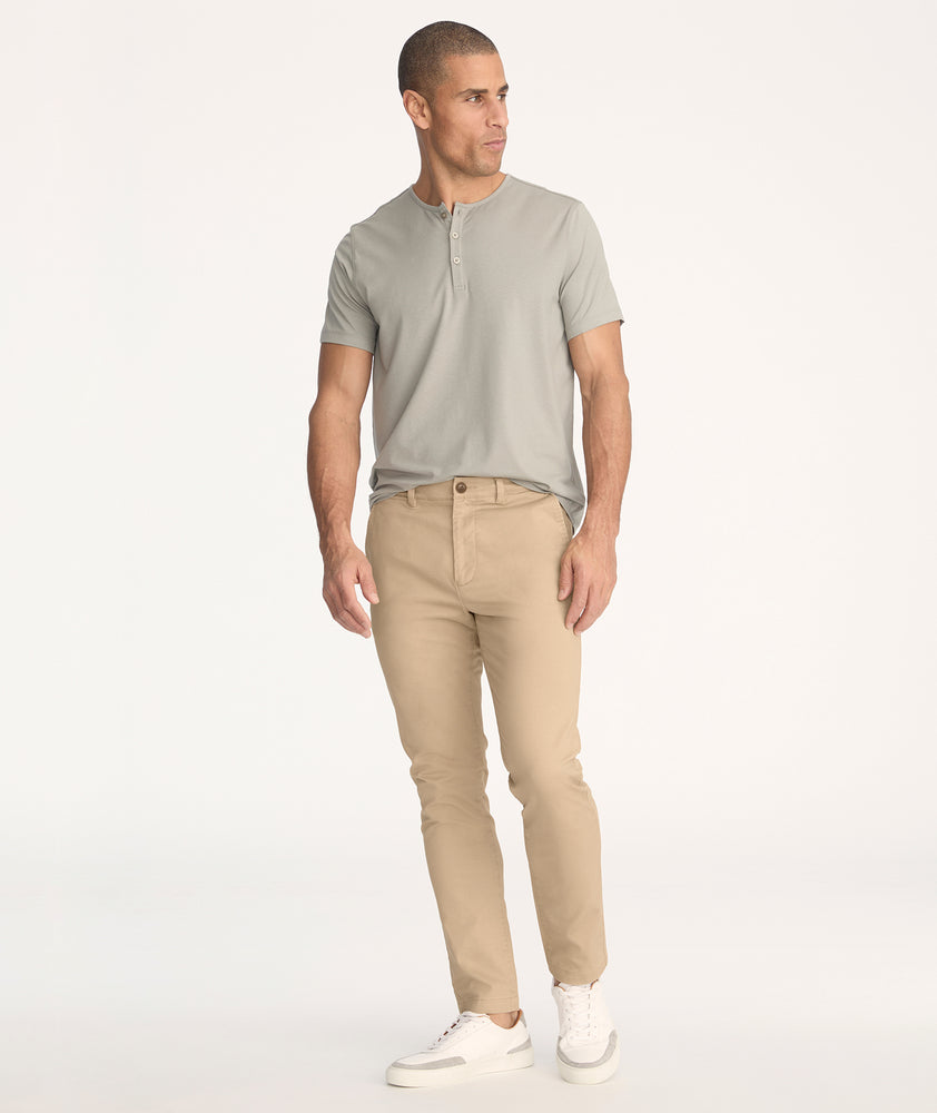 Model is wearing UNTUCKit Classic Chino Pants in Khaki - full body