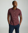 Model is wearing UNTUCKit Performance Short-Sleeve Stanton Shirt	in Maroon.