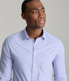 Model is wearing UNTUCKit Starling performance shirt in purple.