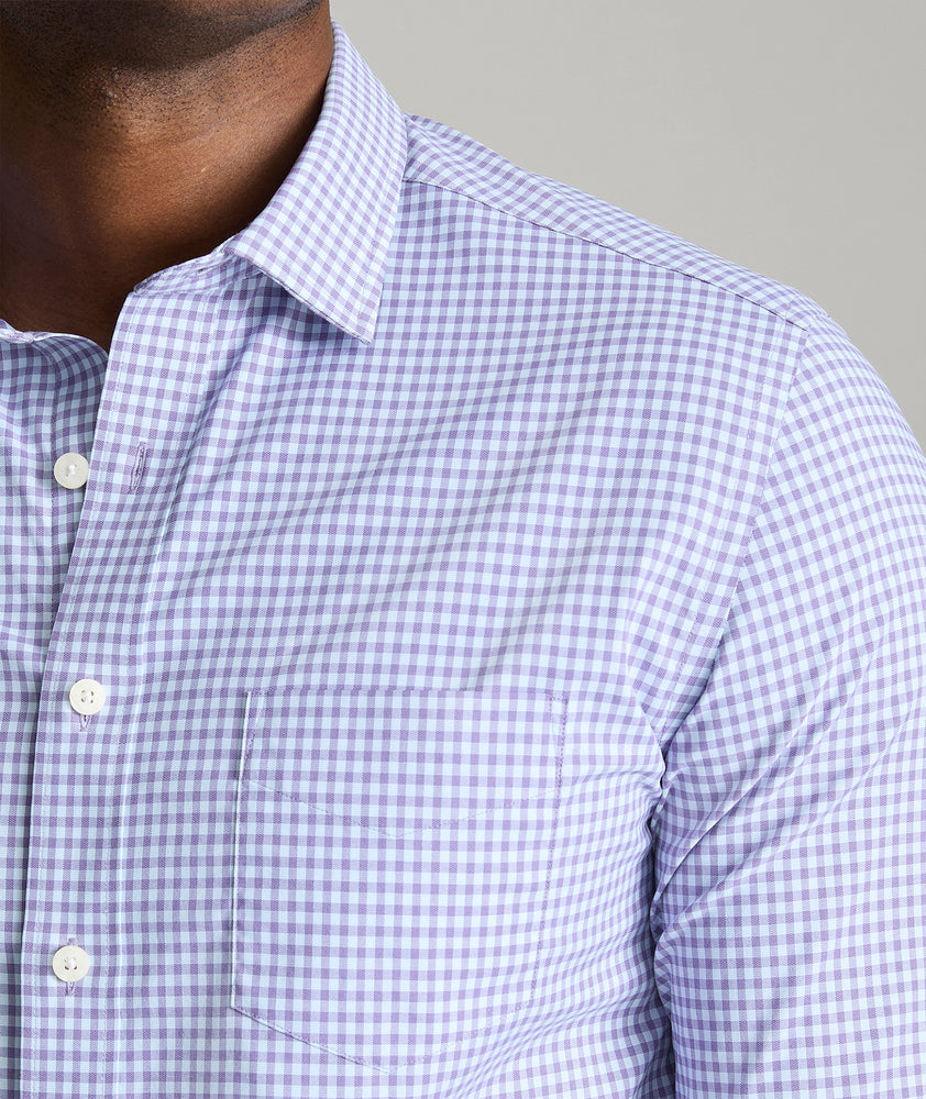 Model is wearing UNTUCKit Starling performance shirt in purple.