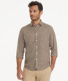 Model is wearing UNTUCKit Wrinkle-Free Steffon Shirt in Small Beech Check.