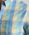 Model is wearing UNTUCKit Stratford vintage wash in plaid yellow. 